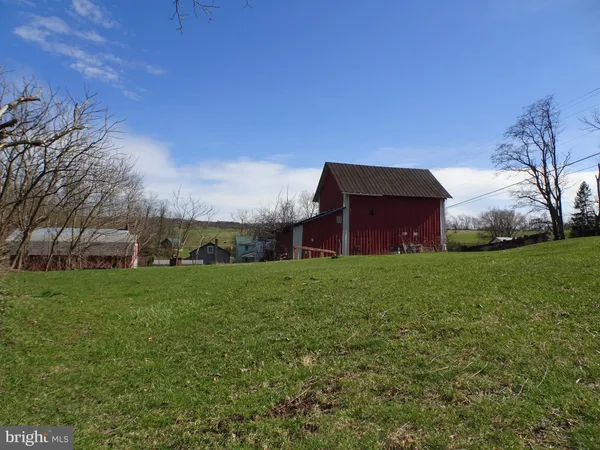 a fire hydrant in the middle of a field