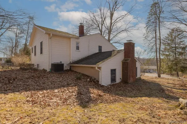 a view of a house with a yard covered in snow