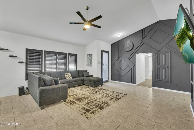 a living room with furniture and a large window