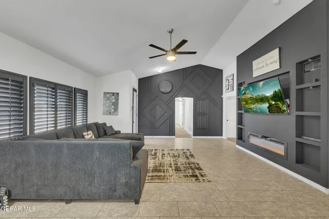 a living room with furniture and a large window