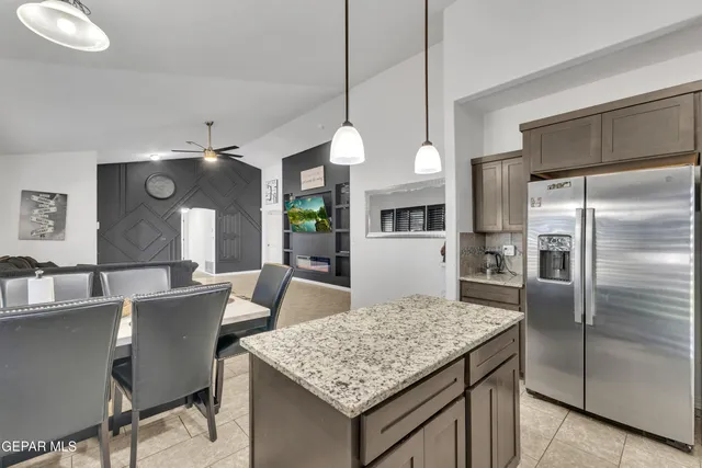 a bathroom with a sink a toilet a mirror and bathtub