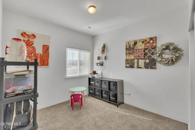 a view of an entryway with wooden shelves