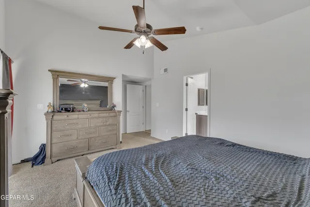 a bathroom with a sink vanity and mirror