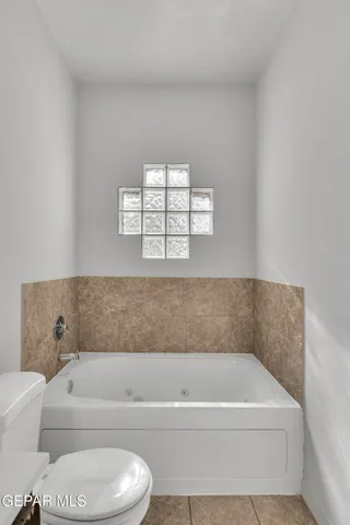 a bathroom with a sink a large mirror and a shower