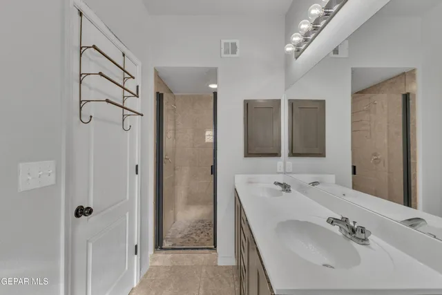 a bathroom with a sink and a shower curtain
