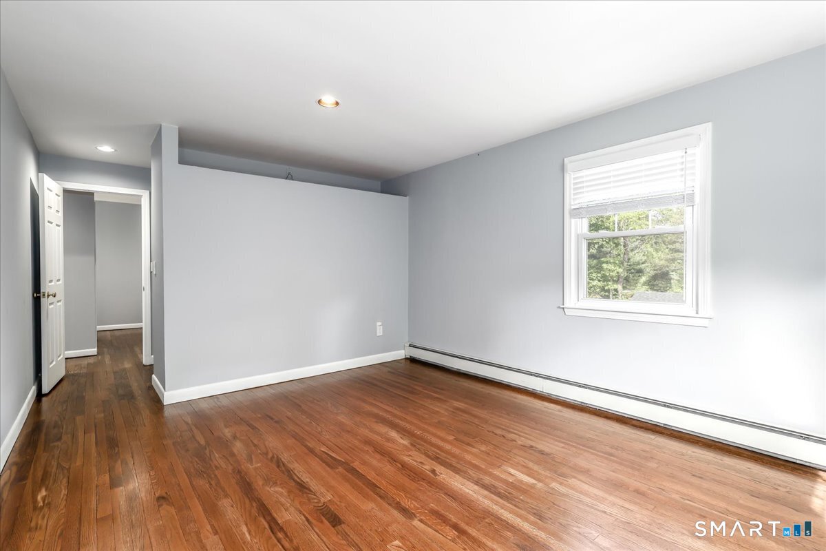 19 Botsford Hill Road Newtown, CT 06470 - Photo 21 of 40 an empty room with wooden floor and windows