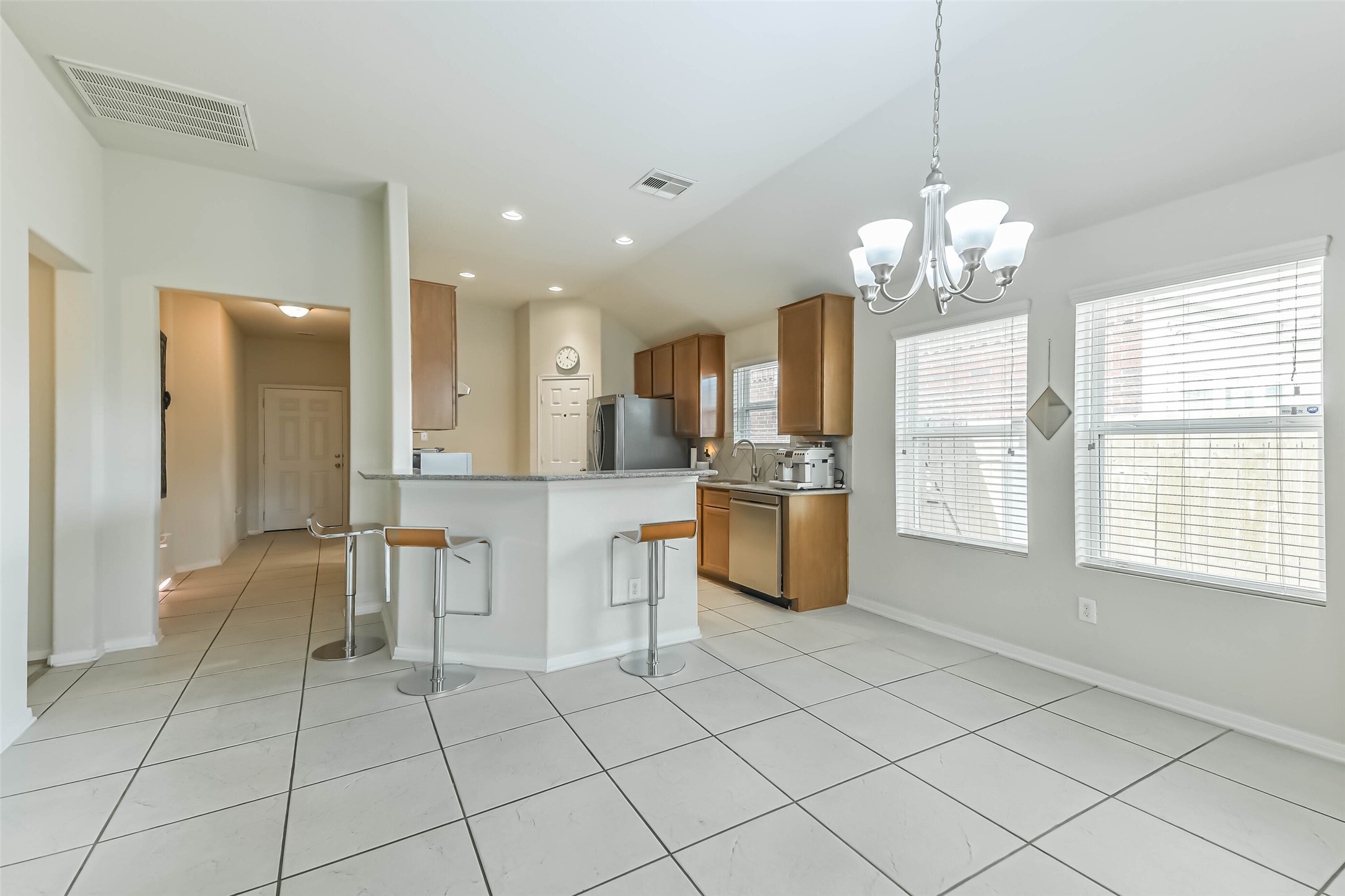2504 Elm Crossing Trail Spring, TX 77386 - Photo 12 of 40 a view of kitchen with granite countertop cabinets and refrigerator
