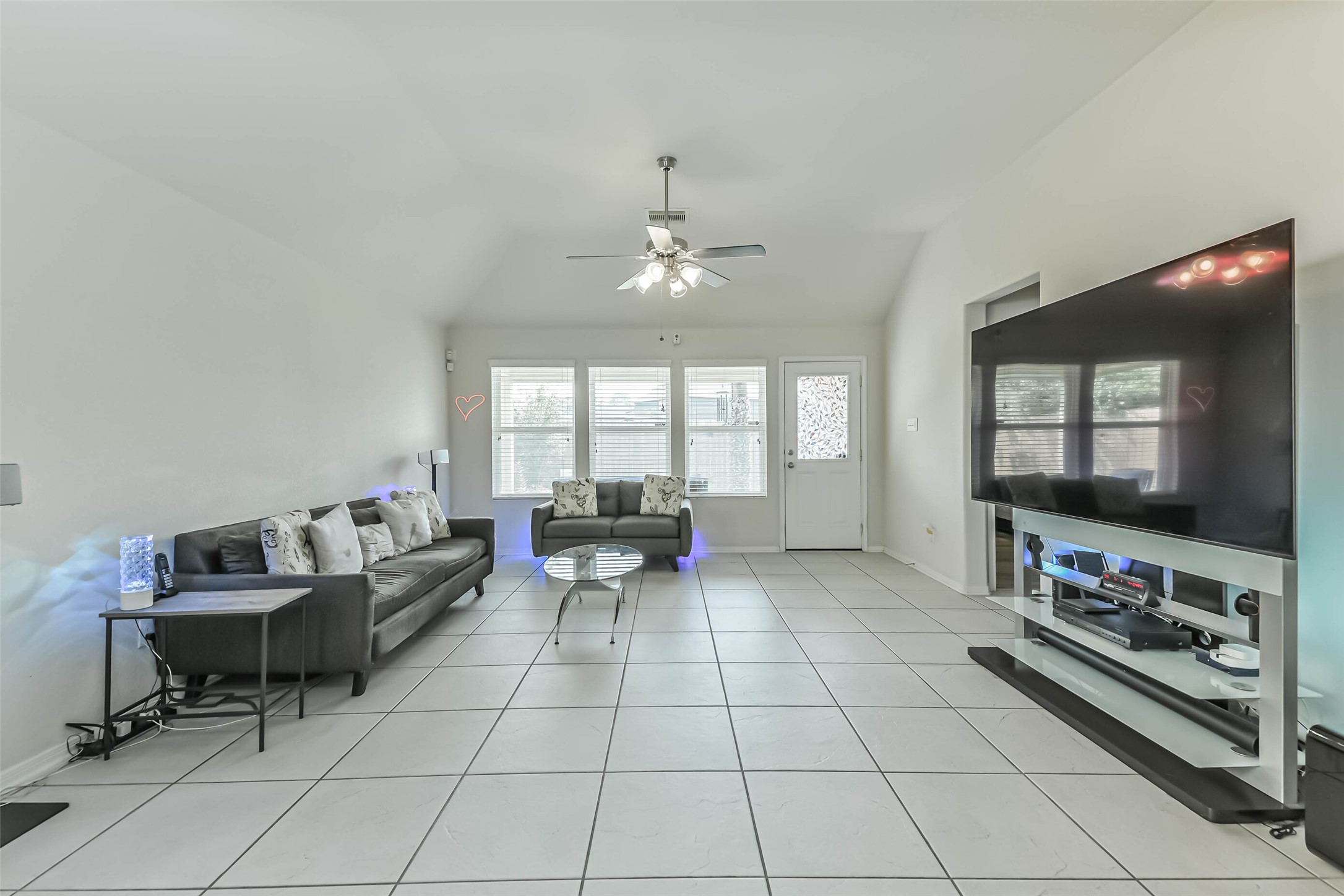 2504 Elm Crossing Trail Spring, TX 77386 - Photo 14 of 40 a living room with furniture and a flat screen tv