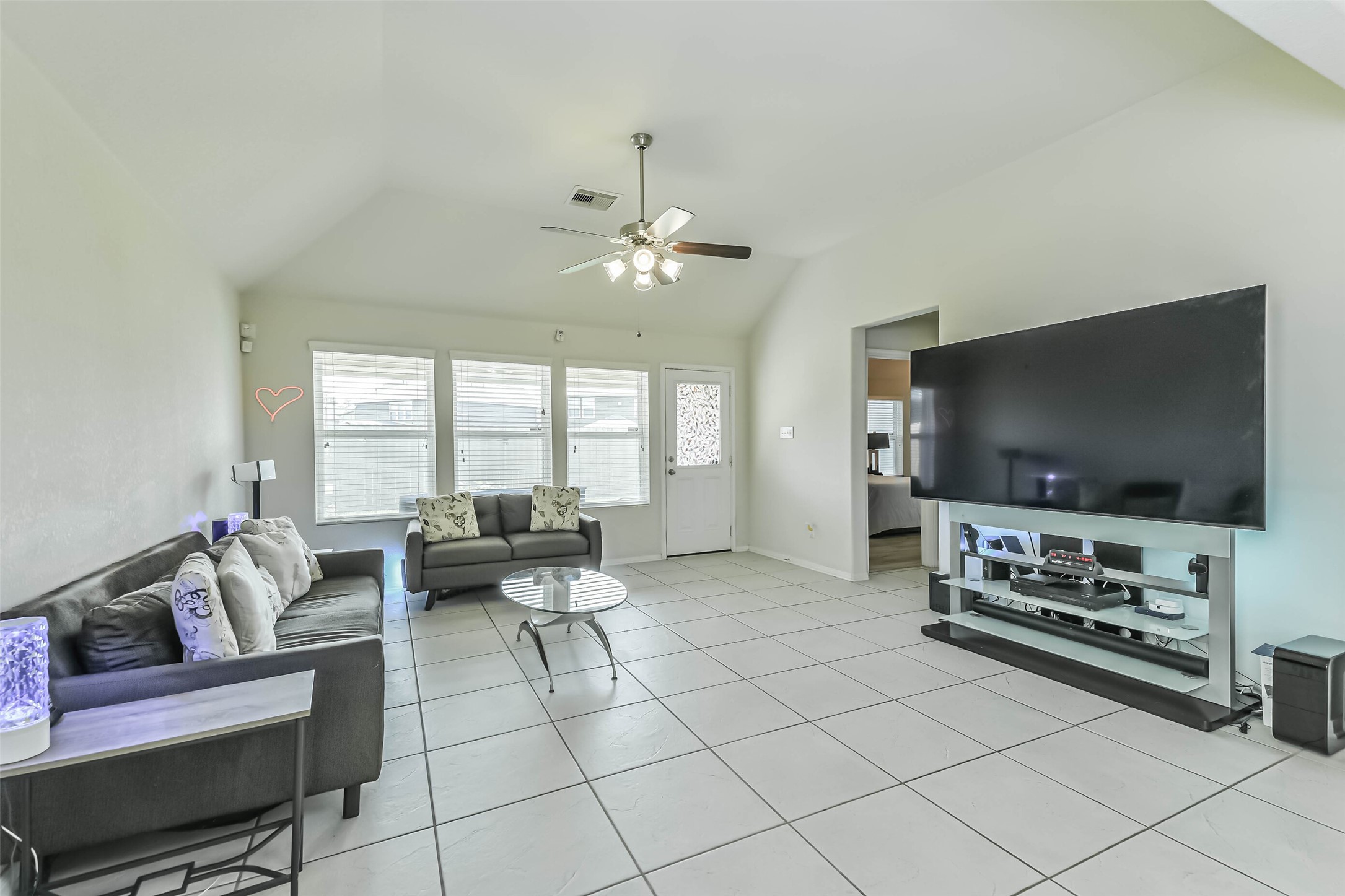 2504 Elm Crossing Trail Spring, TX 77386 - Photo 15 of 40 a living room with furniture and a flat screen tv