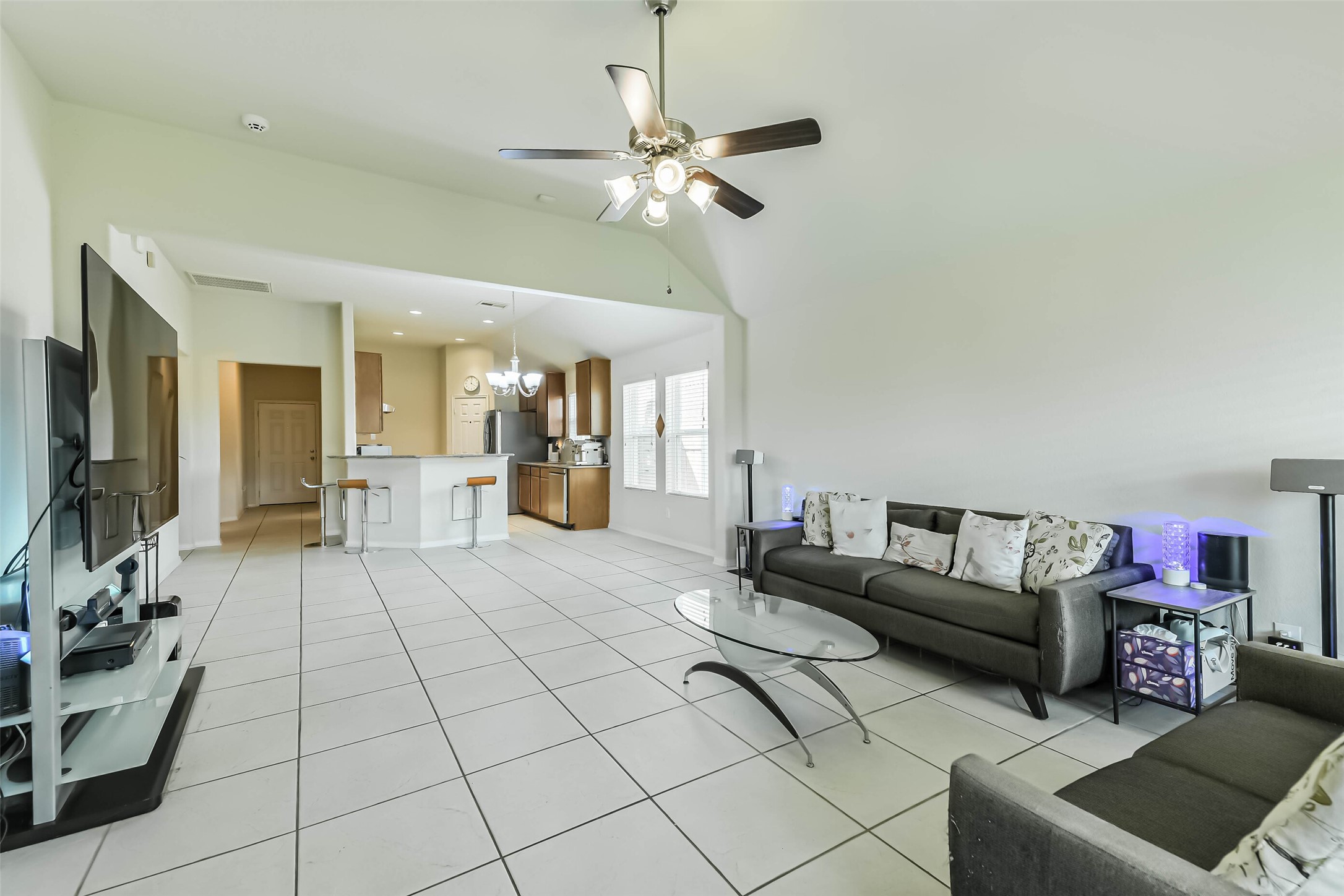 2504 Elm Crossing Trail Spring, TX 77386 - Photo 16 of 40 a living room with furniture and a chandelier