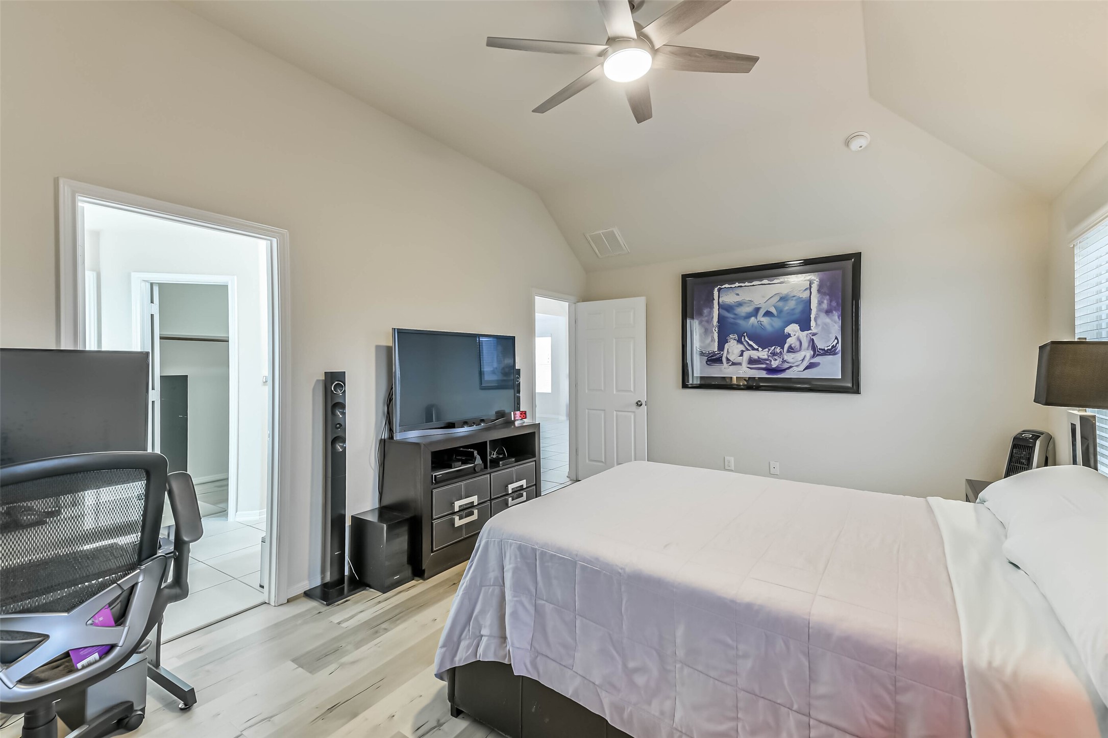 2504 Elm Crossing Trail Spring, TX 77386 - Photo 19 of 40 a bedroom with a bed and a flat screen tv