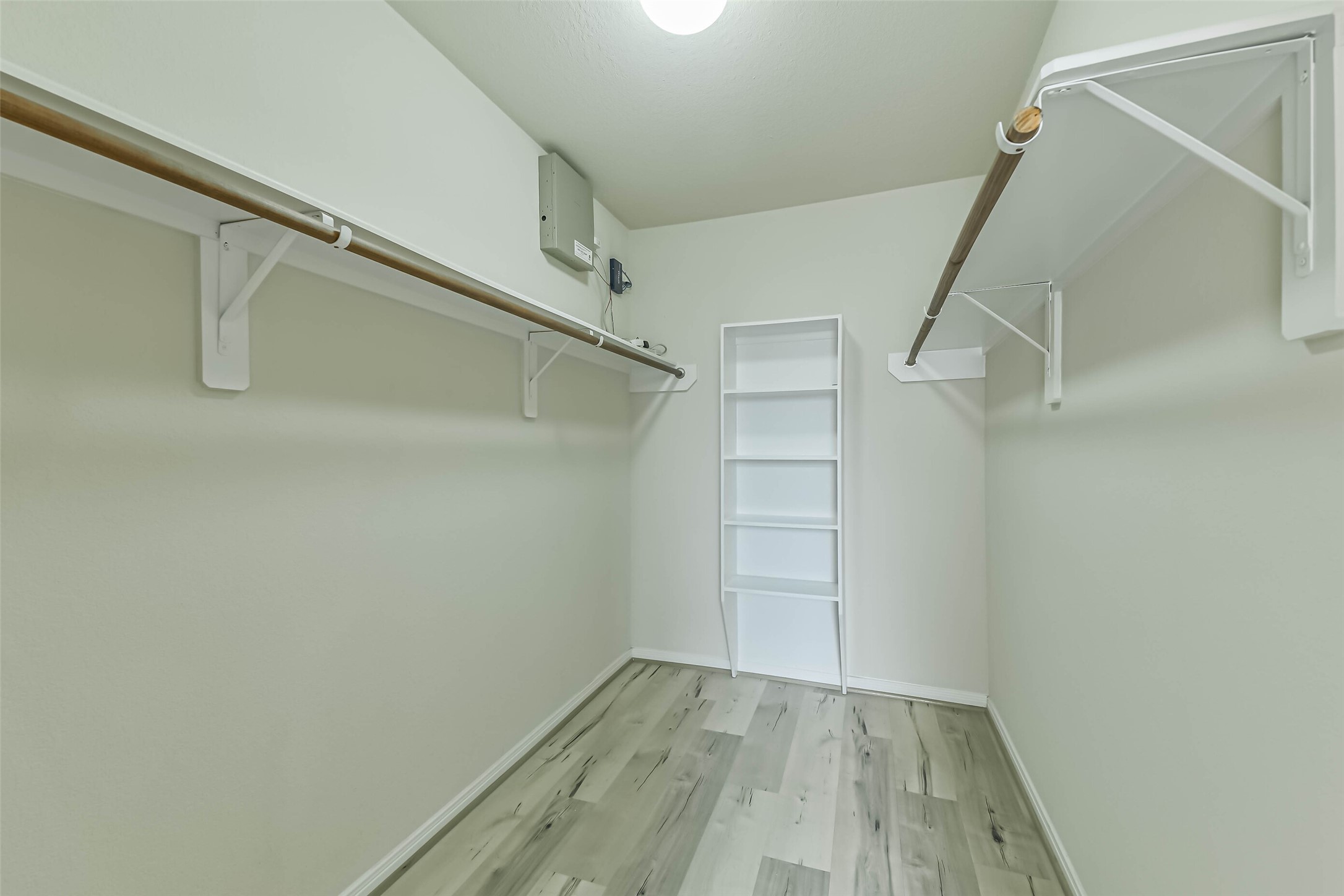 2504 Elm Crossing Trail Spring, TX 77386 - Photo 23 of 40 a view of walk in closet with empty racks