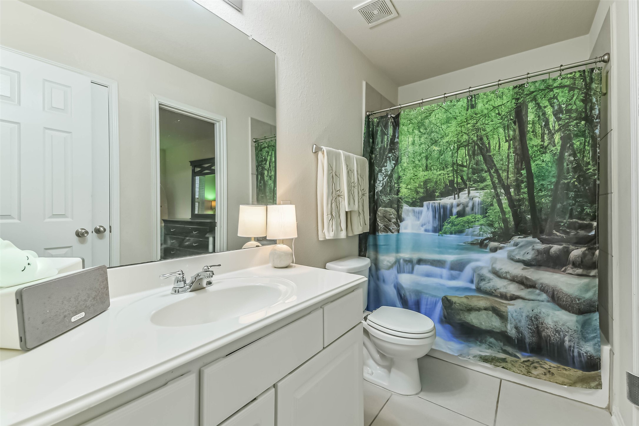 2504 Elm Crossing Trail Spring, TX 77386 - Photo 27 of 40 a bathroom with a toilet sink and mirror