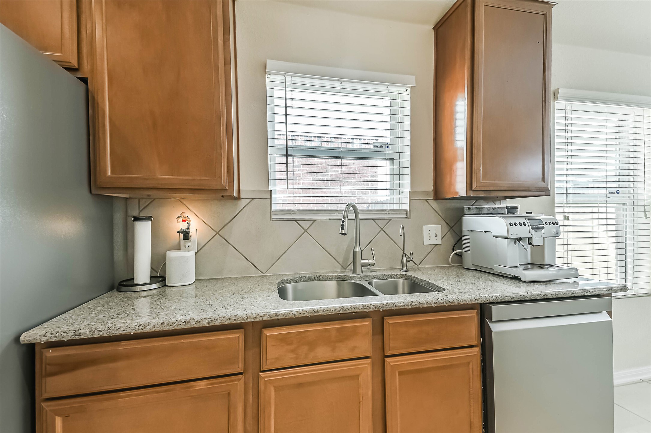2504 Elm Crossing Trail Spring, TX 77386 - Photo 7 of 40 a kitchen with granite countertop cabinets and window