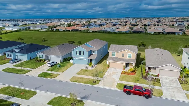 an aerial view of a house with a garden