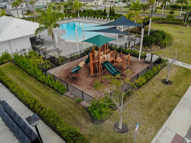 an aerial view of a house with outdoor space