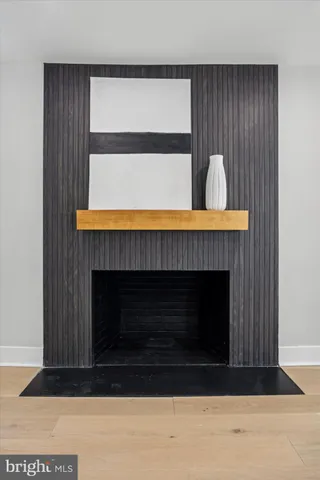 a living room with furniture flowerpot and a potted plant