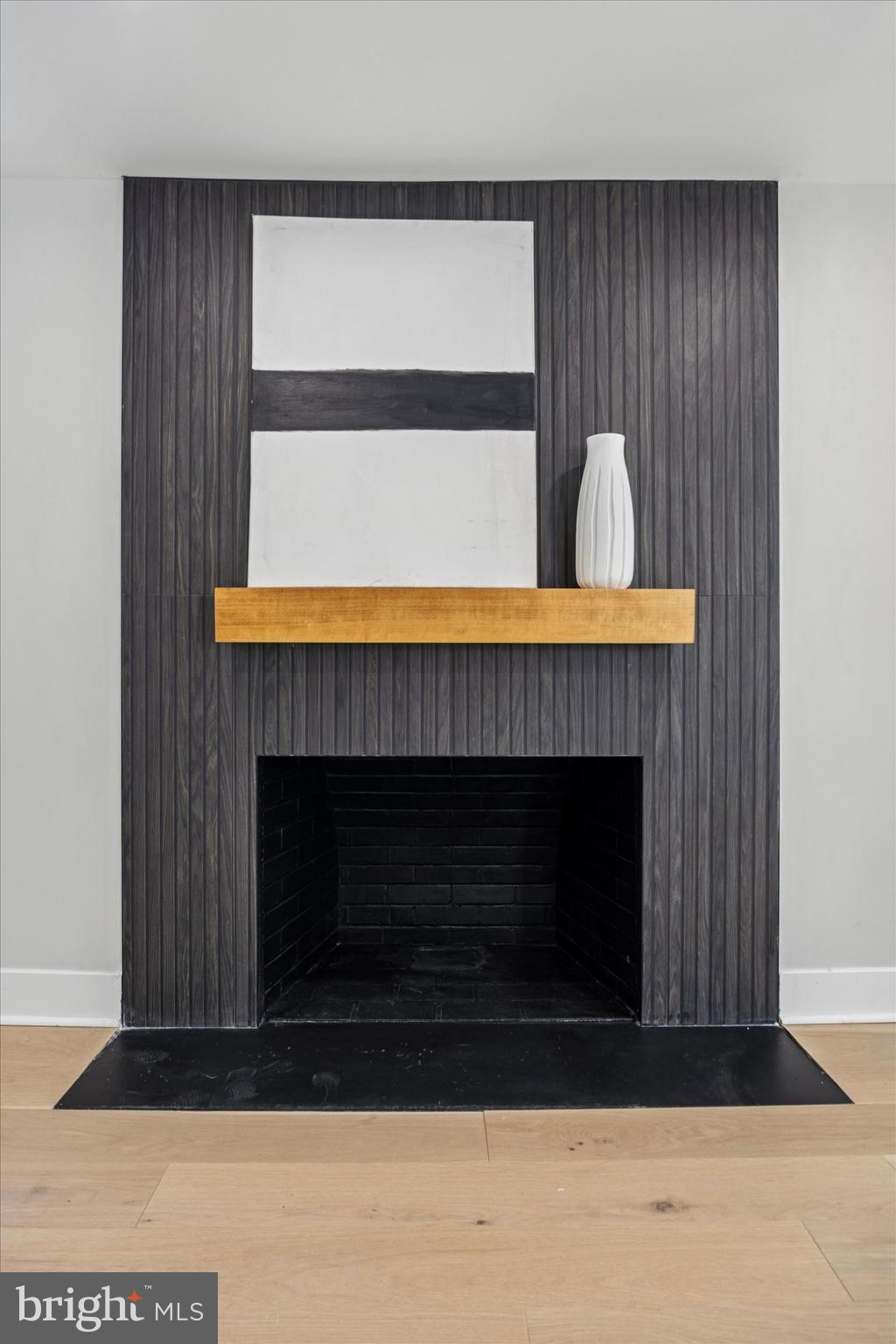 219 Williamsburg Road Ardmore, PA 19003 - Photo 11 of 75 a living room with a fireplace and a table