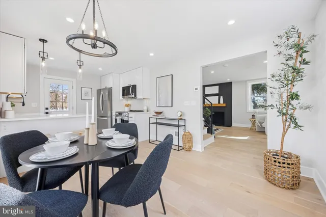 a kitchen with stainless steel appliances a sink stove and microwave