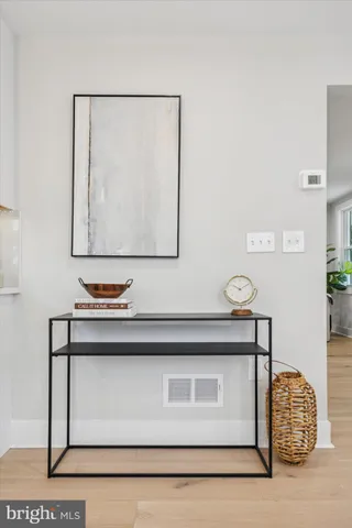 a view of a hallway with a livingroom and stairs