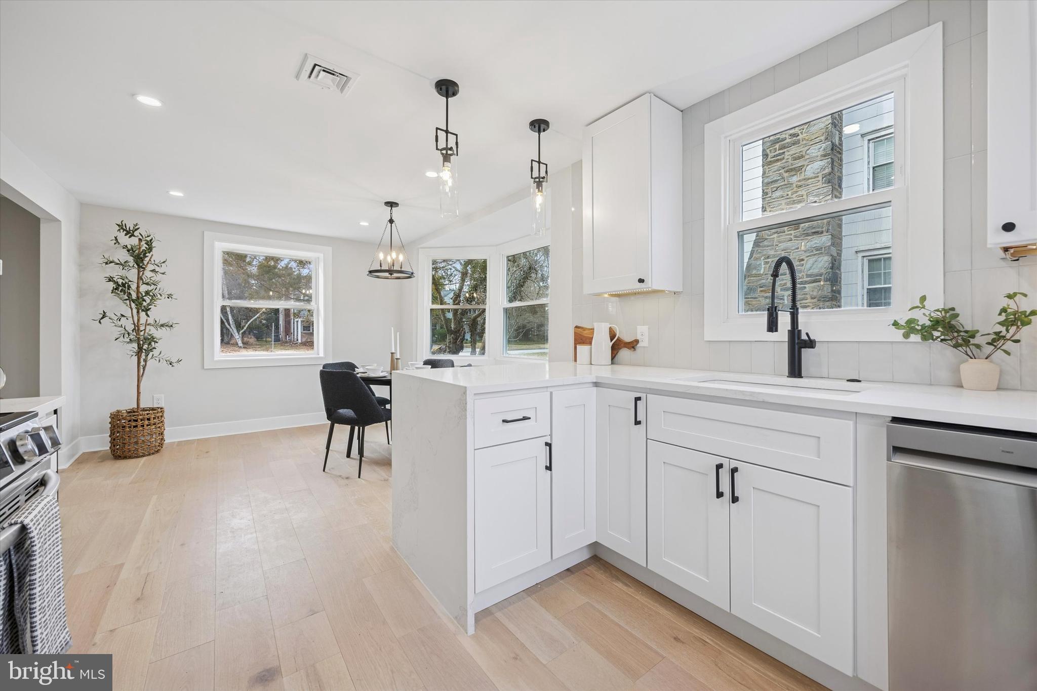 219 Williamsburg Road Ardmore, PA 19003 - Photo 22 of 75 a spacious en suite bathroom with a double vanity sink a mirror a and a window
