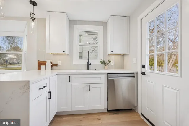 a bathroom with a double vanity sink a mirror and shower