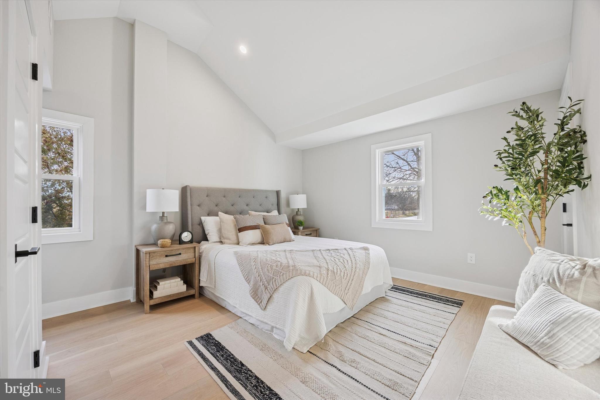 219 Williamsburg Road Ardmore, PA 19003 - Photo 27 of 75 a bedroom with a bed and a couch