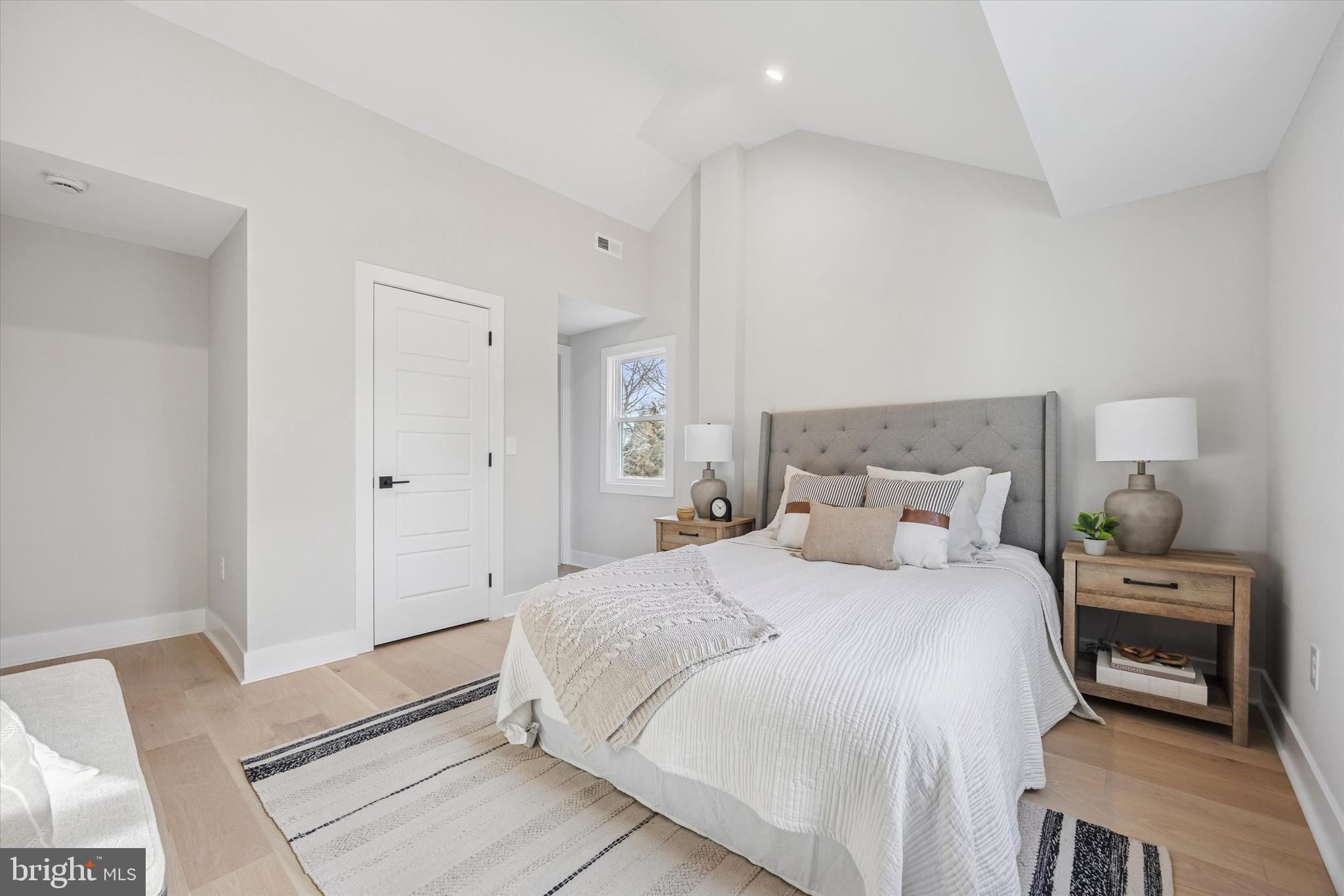 219 Williamsburg Road Ardmore, PA 19003 - Photo 29 of 75 a bedroom with a bed and a mirror