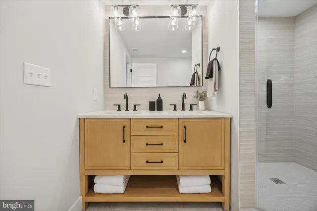 a bathroom with a sink a toilet and tub
