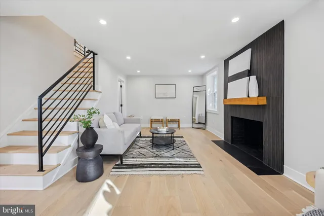 a living room with furniture and a rug