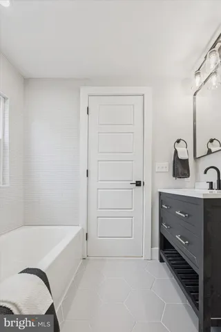 a view of a house with a yard covered in snow