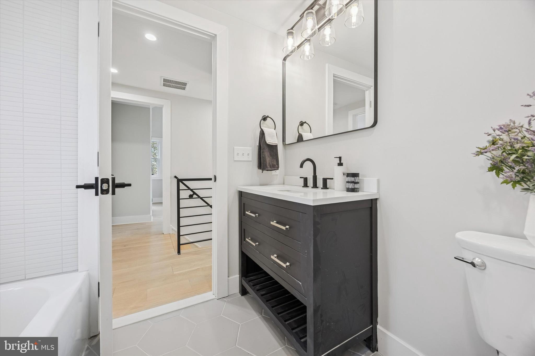 219 Williamsburg Road Ardmore, PA 19003 - Photo 51 of 75 a bathroom with a sink a toilet and shower