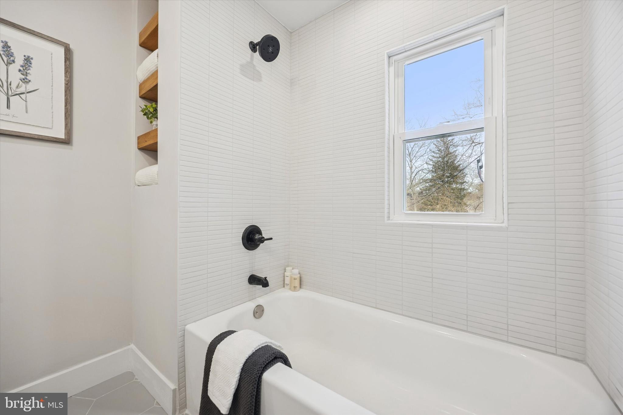 219 Williamsburg Road Ardmore, PA 19003 - Photo 52 of 75 a bathroom with a tub and a shower