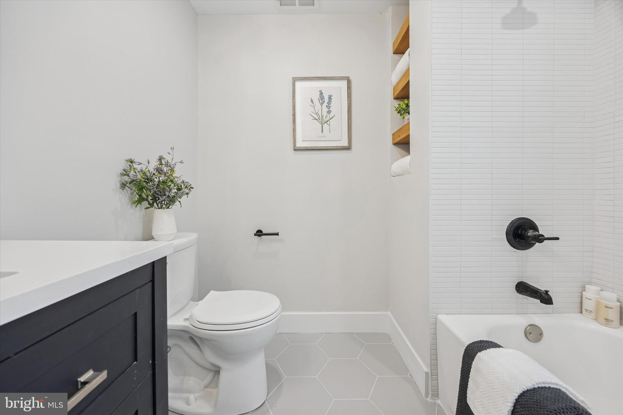 219 Williamsburg Road Ardmore, PA 19003 - Photo 53 of 75 a bathroom with a sink a toilet and tub