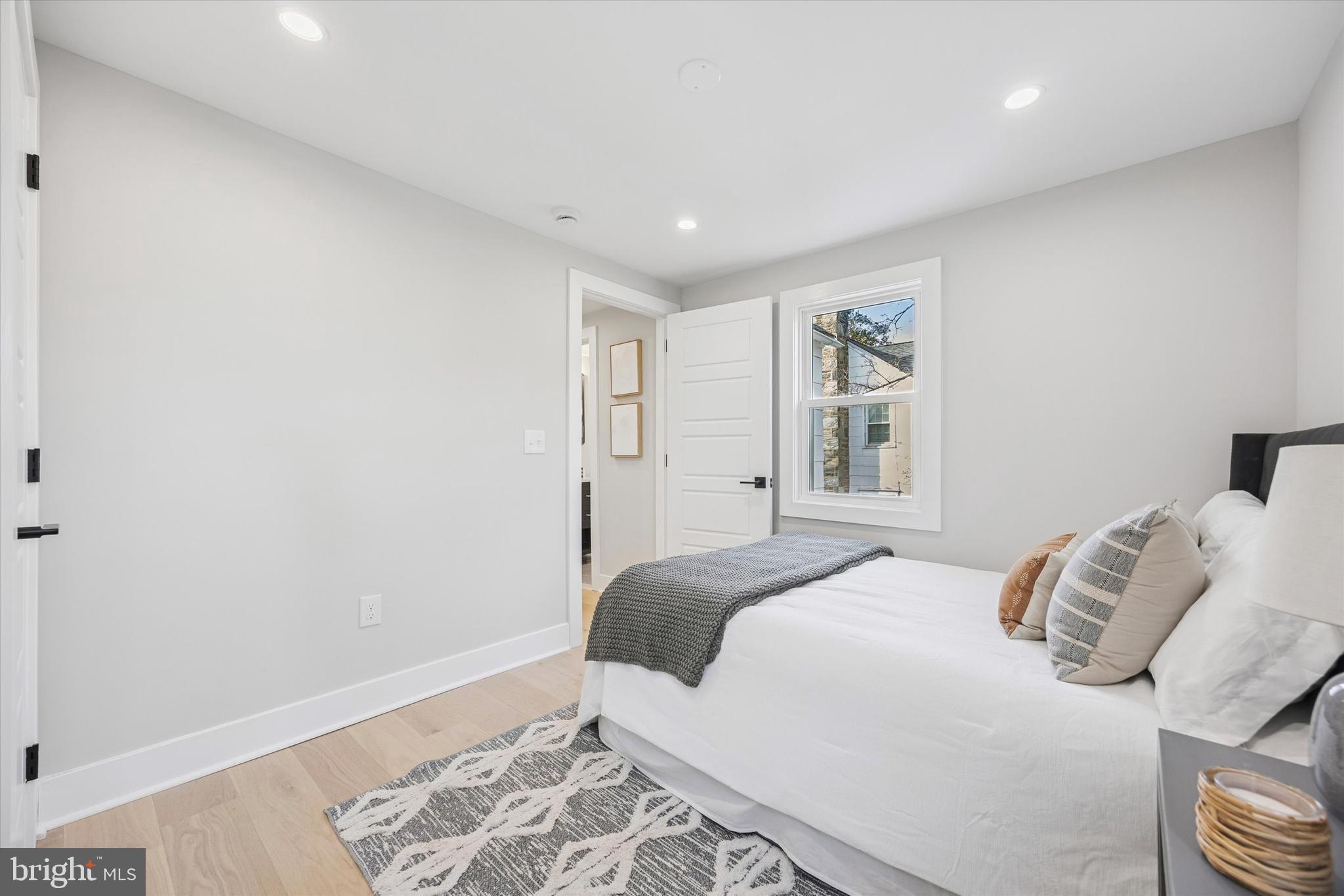 219 Williamsburg Road Ardmore, PA 19003 - Photo 57 of 75 a bedroom with a bed and a window