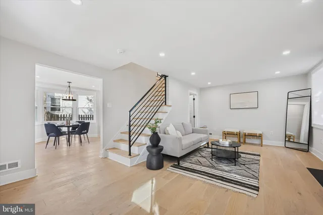 a living room with furniture and a rug