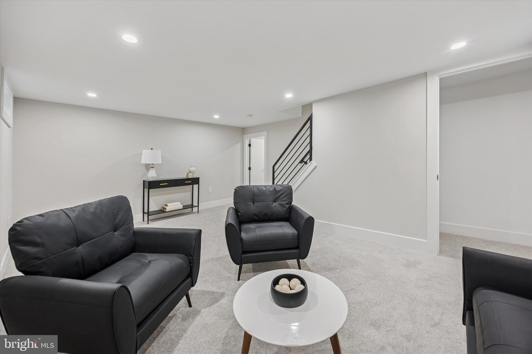219 Williamsburg Road Ardmore, PA 19003 - Photo 62 of 75 a living room with furniture and a view of kitchen appliances