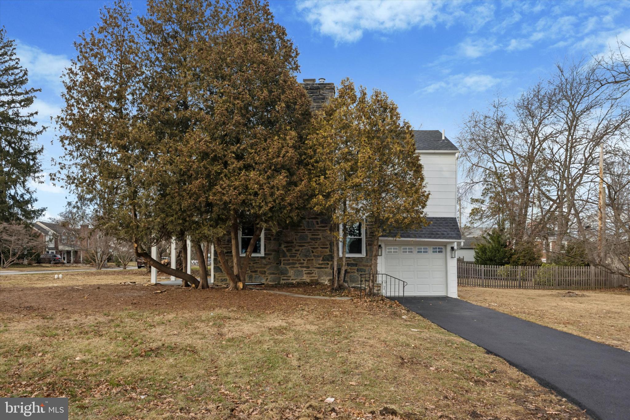 219 Williamsburg Road Ardmore, PA 19003 - Photo 69 of 75 a front view of a house with a yard and garage