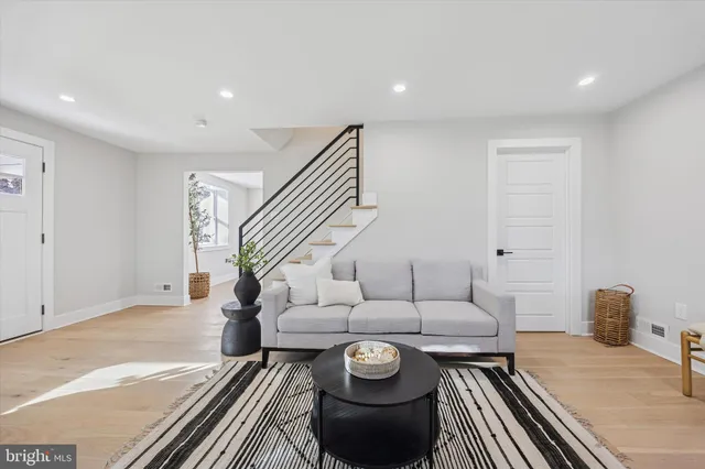 a living room with furniture and a lamp