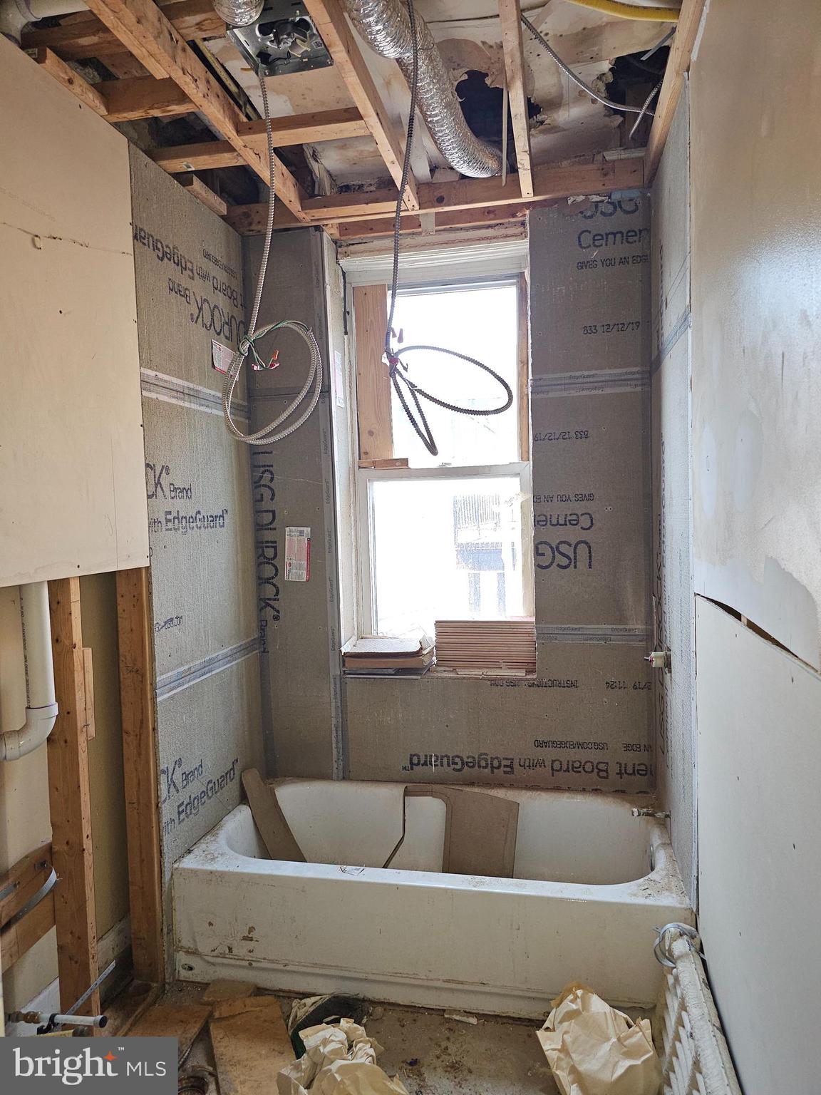 3514 Bank Street Baltimore, MD 21224 - Photo 15 of 71 a bathroom with a tub and a window