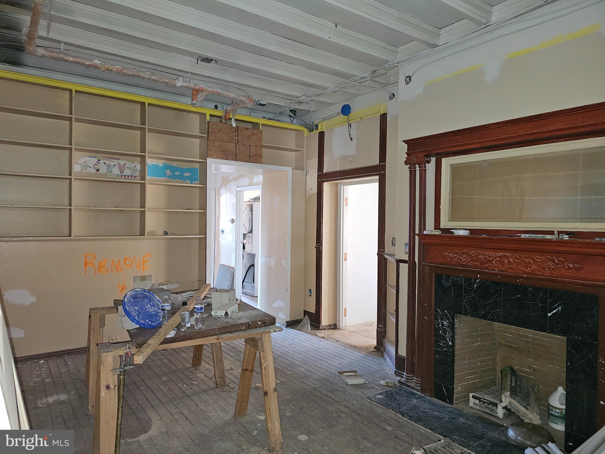 3514 Bank Street Baltimore, MD 21224 - Photo 25 of 71 a living room with a fireplace furniture and a window
