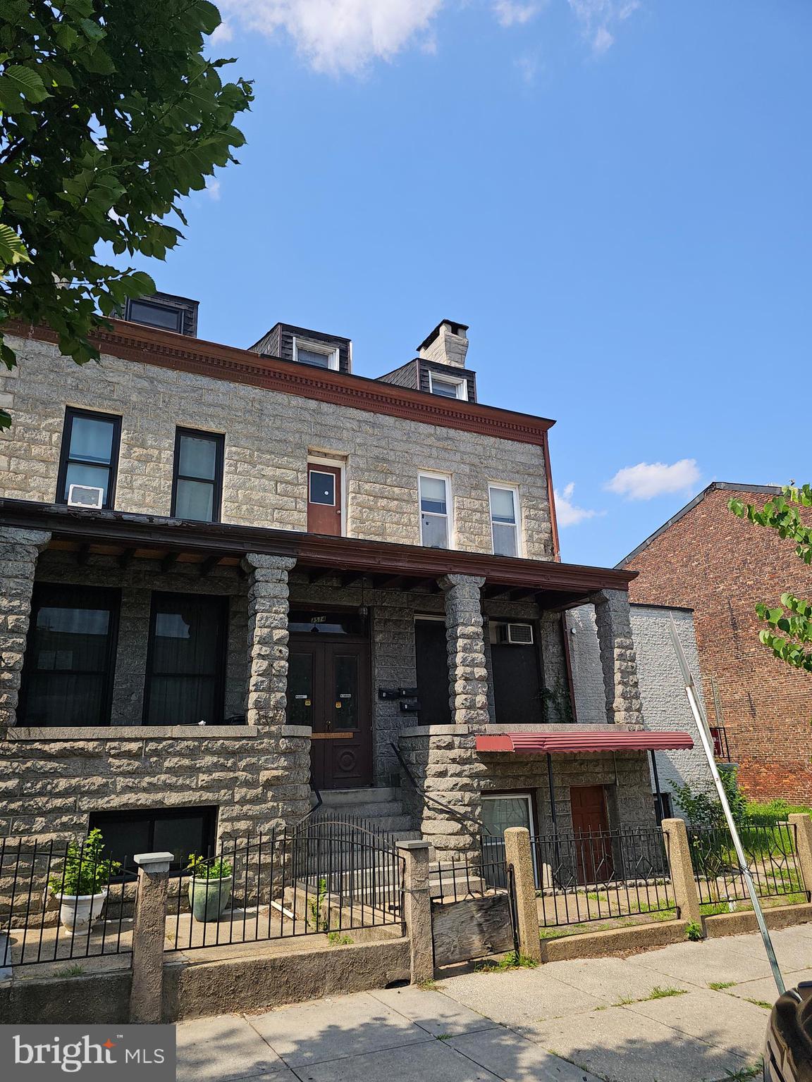 3514 Bank Street Baltimore, MD 21224 - Photo 3 of 71 a front view of a house with glass windows