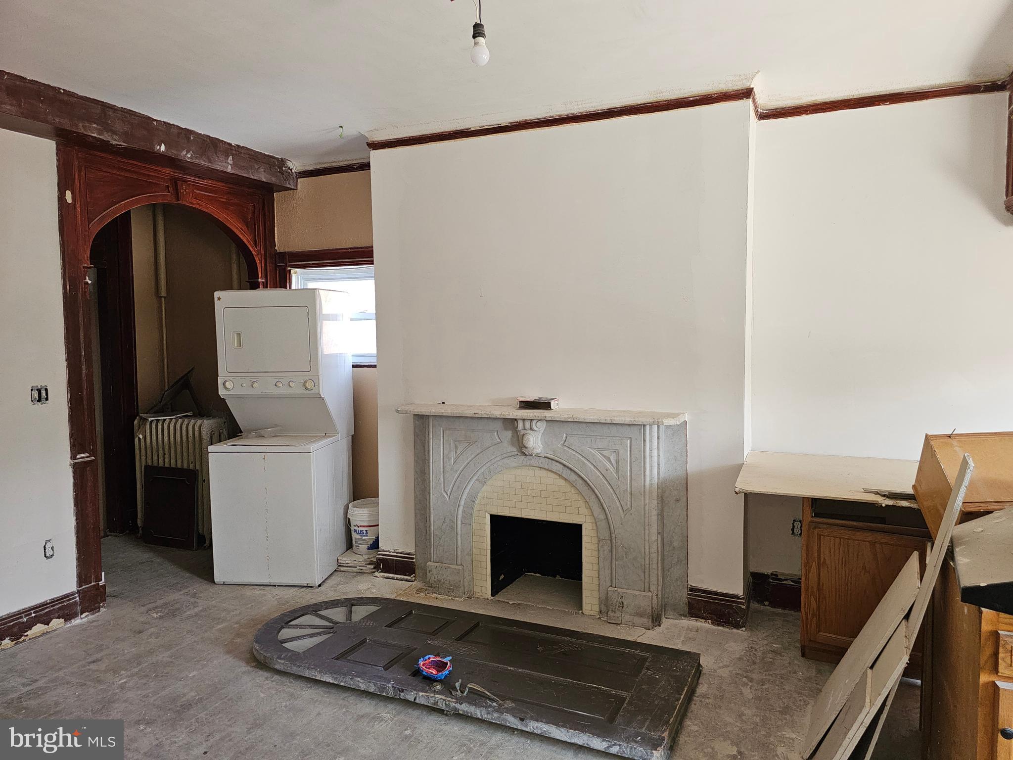 3514 Bank Street Baltimore, MD 21224 - Photo 40 of 71 a living room with furniture and a fireplace