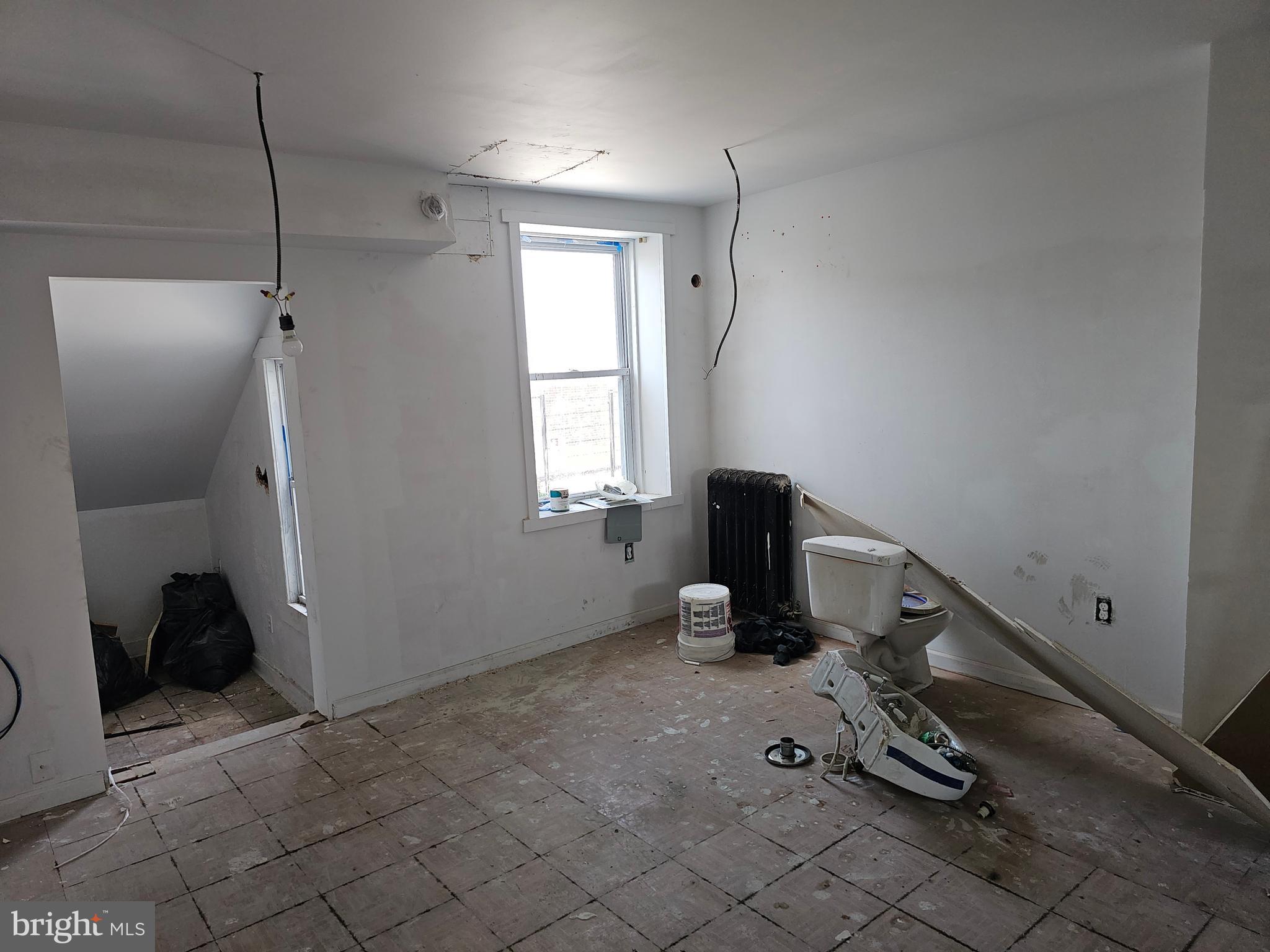 3514 Bank Street Baltimore, MD 21224 - Photo 52 of 71 a view of a workspace with furniture and a window