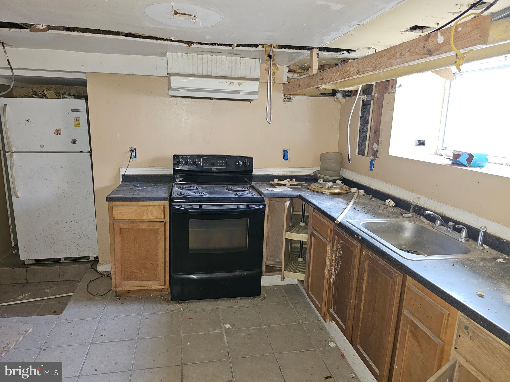 3514 Bank Street Baltimore, MD 21224 - Photo 63 of 71 a kitchen with a stove top oven and sink