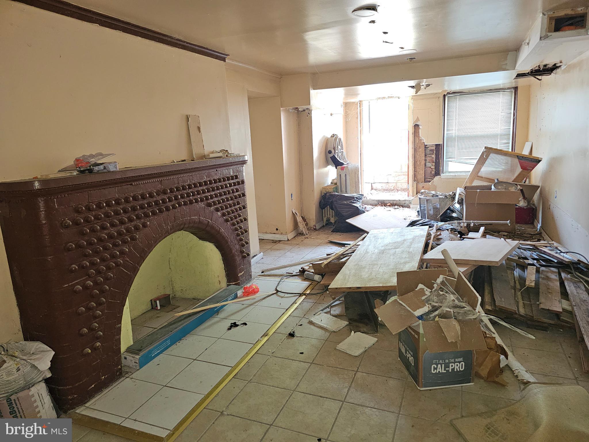 3514 Bank Street Baltimore, MD 21224 - Photo 69 of 71 a living room with furniture and a fireplace