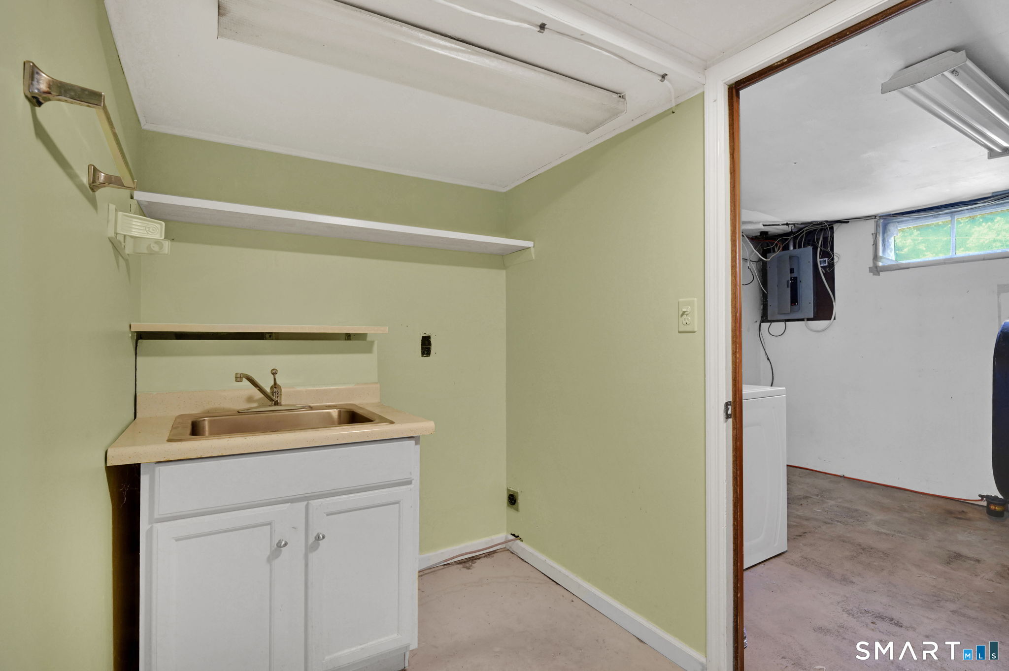 7 Rogers Drive Meriden, CT 06450 - Photo 29 of 40 a bathroom with a sink and a mirror