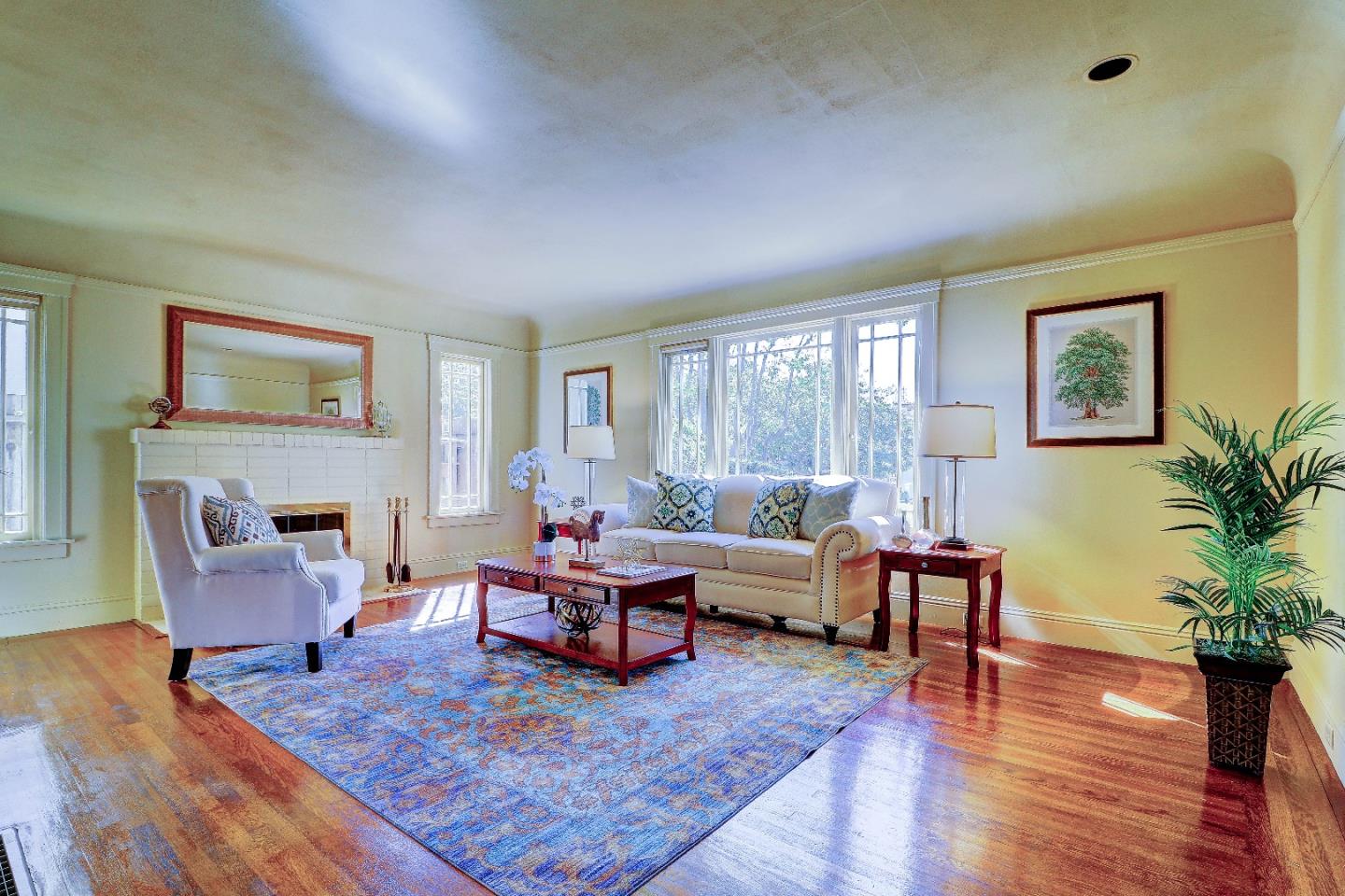 2701 Hillside Drive Burlingame, CA 94010 - Photo 11 of 50 a living room with furniture and a fireplace