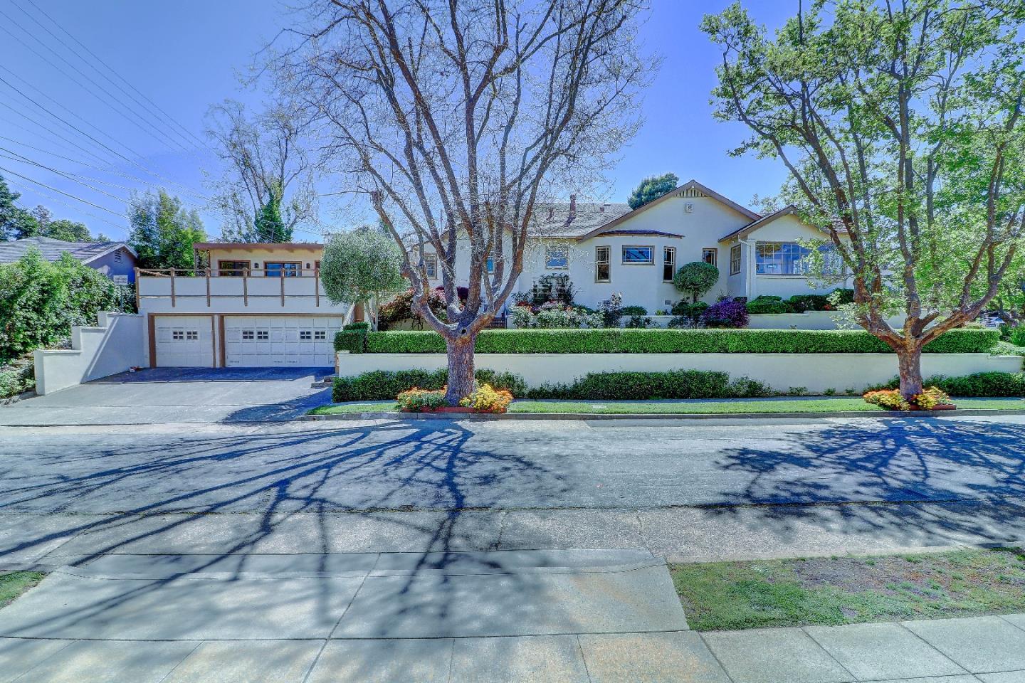 2701 Hillside Drive Burlingame, CA 94010 - Photo 2 of 50 a front view of house with yard and green space