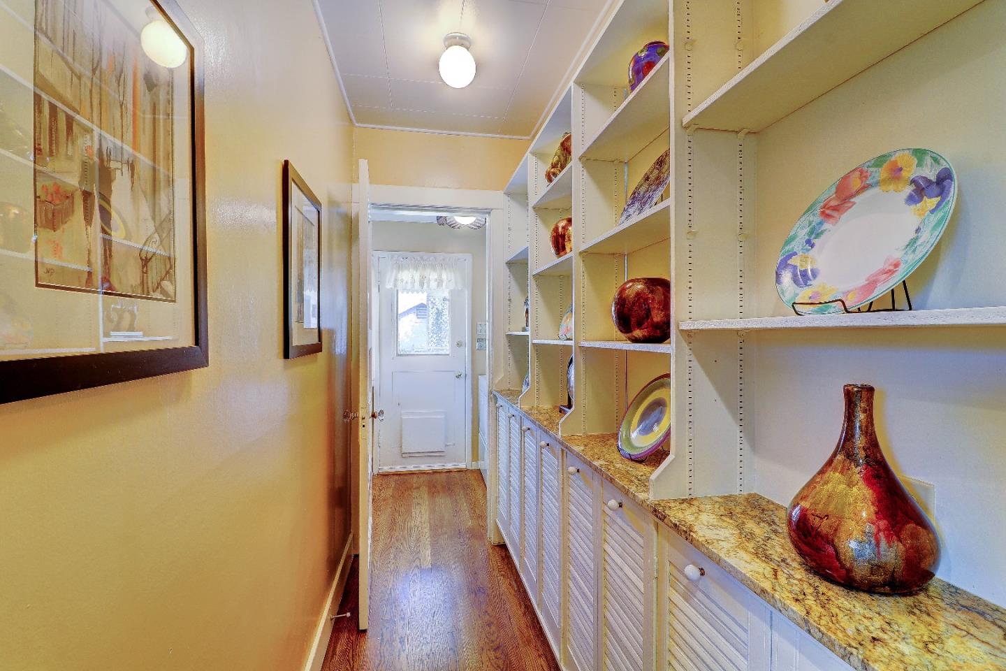 2701 Hillside Drive Burlingame, CA 94010 - Photo 21 of 50 a view of entryway with a hallway and wooden floor